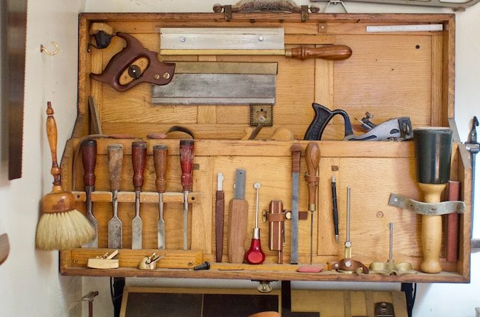 a workbench filled with lots of tools