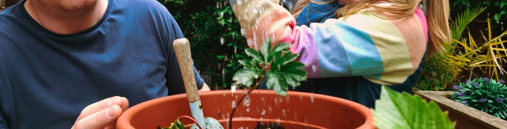 a person and a girl in a garden
