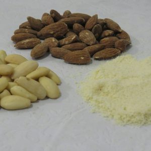 a pile of nuts next to a pile of rice