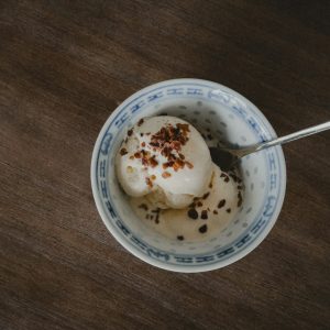 A bowl of ice cream with a spoon in it