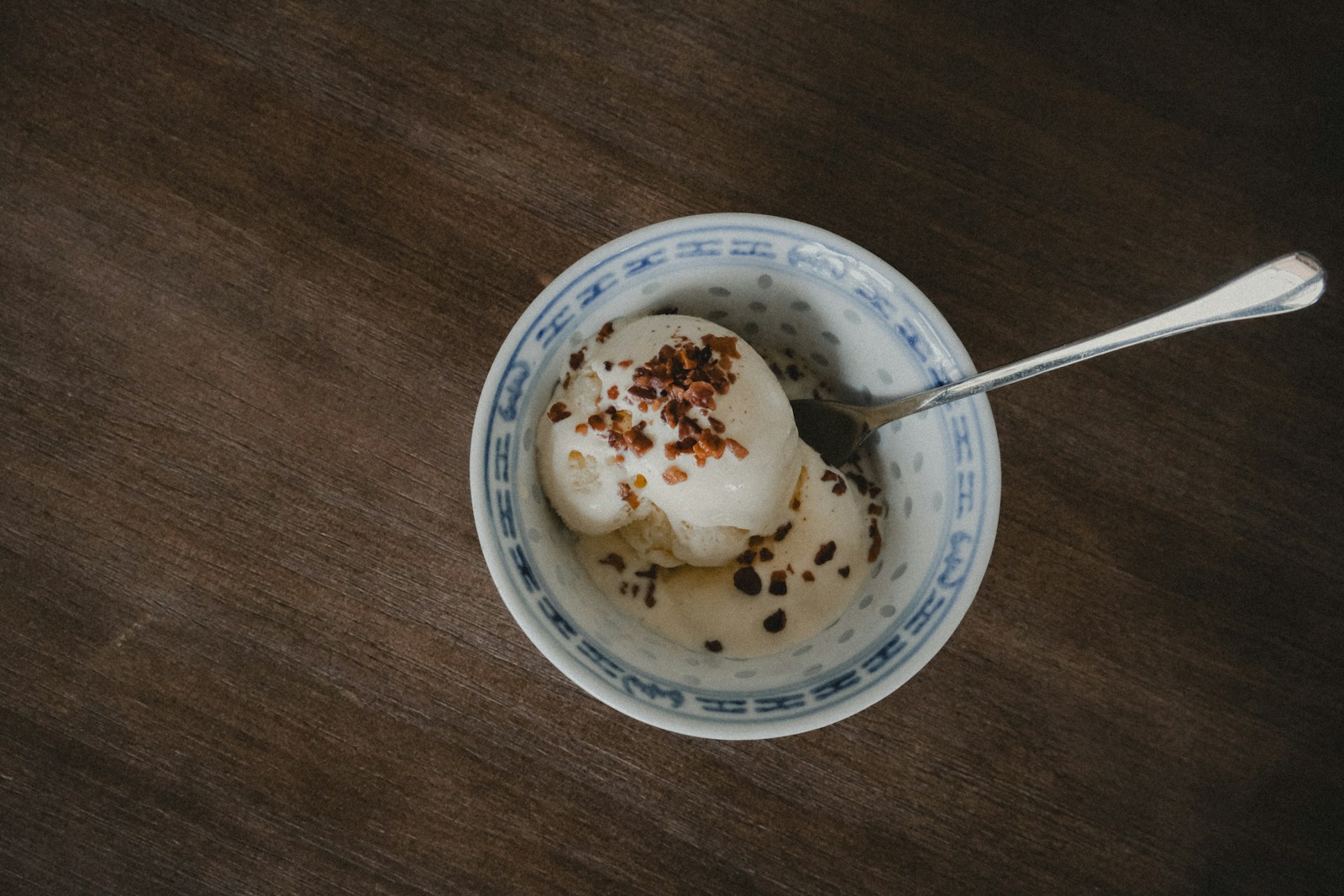 A bowl of ice cream with a spoon in it