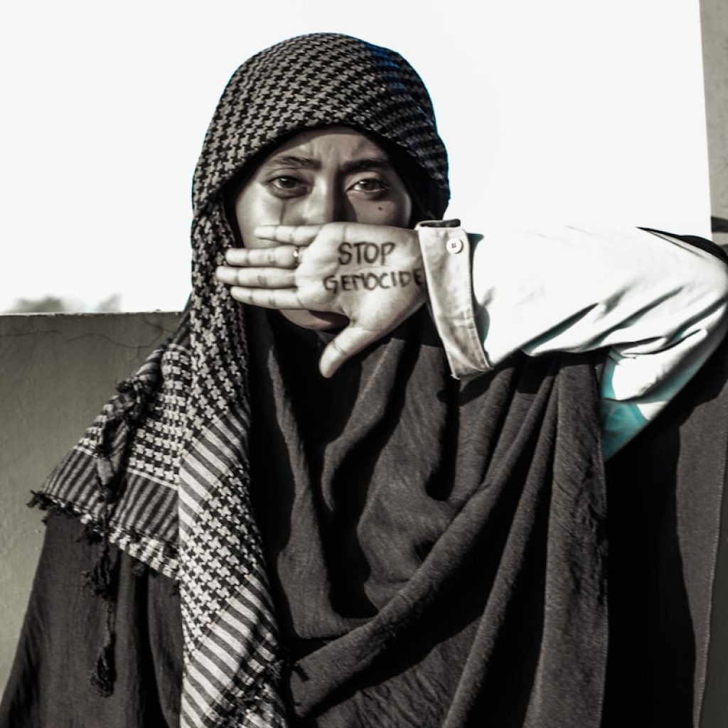 A woman with a scarf covering her face